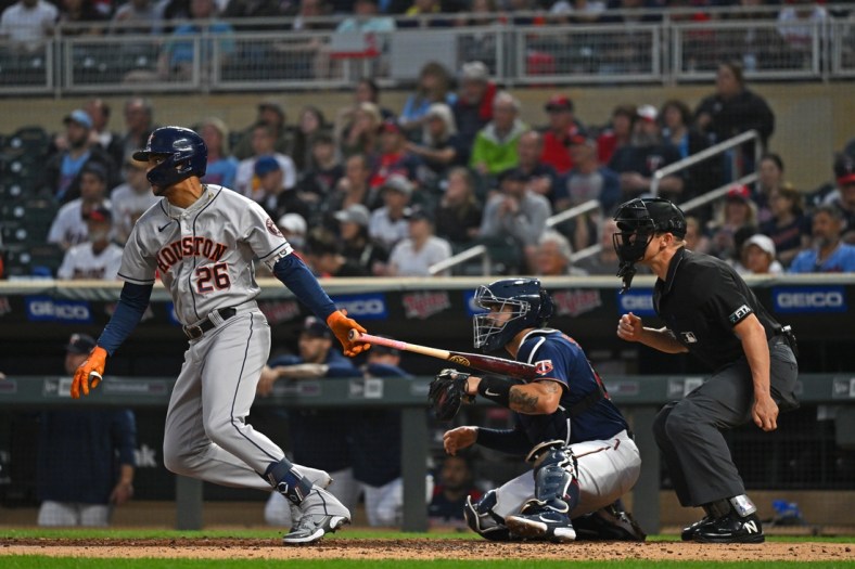 May 11, 2022; Minneapolis, Minnesota, USA;  Houston Astros center fielder Jose Siri (26) hits an RBI single against the Minnesota Twins during the second inning at Target Field. Mandatory Credit: Nick Wosika-USA TODAY Sports