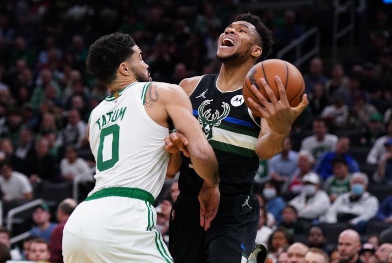 May 11, 2022; Boston, Massachusetts, USA; Boston Celtics forward Jayson Tatum (0) defends against Milwaukee Bucks forward Giannis Antetokounmpo (34) in the second half during game five of the second round for the 2022 NBA playoffs at TD Garden. Mandatory Credit: David Butler II-USA TODAY Sports