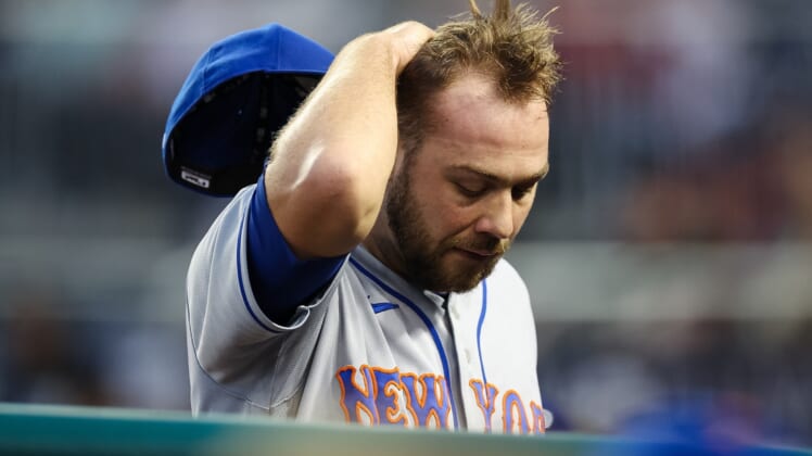 May 11, 2022; Washington, District of Columbia, USA; New York Mets starting pitcher Tylor Megill (38) reacts after being pulled from the game  during the second inning against the Washington Nationals at Nationals Park. Mandatory Credit: Scott Taetsch-USA TODAY Sports