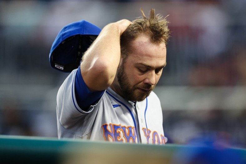 May 11, 2022; Washington, District of Columbia, USA; New York Mets starting pitcher Tylor Megill (38) reacts after being pulled from the game  during the second inning against the Washington Nationals at Nationals Park. Mandatory Credit: Scott Taetsch-USA TODAY Sports