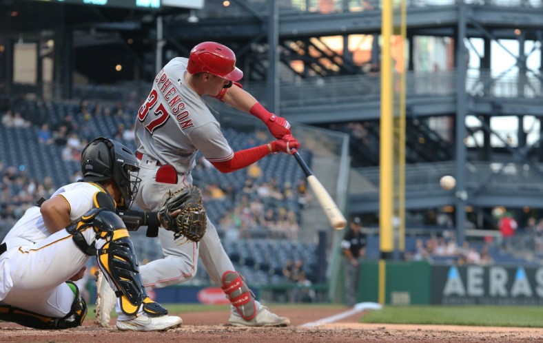 May 12, 2022; Pittsburgh, Pennsylvania, USA; Cincinnati Reds catcher Tyler Stephenson (37) hits a solo home run against the Pittsburgh Pirates during the fourth inning at PNC Park. Mandatory Credit: Charles LeClaire-USA TODAY Sports