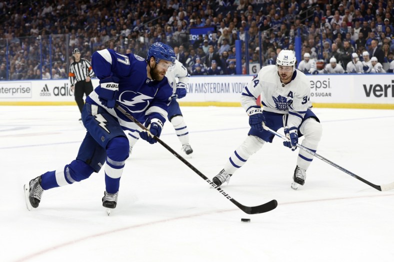 May 12, 2022; Tampa, Florida, USA; Tampa Bay Lightning defenseman Victor Hedman (77) skates with the puck as Toronto Maple Leafs center Auston Matthews (34) defends during the first period of game six of the first round of the 2022 Stanley Cup Playoffs at Amalie Arena. Mandatory Credit: Kim Klement-USA TODAY Sports