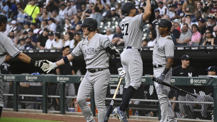 May 12, 2022; Chicago, Illinois, USA; New York Yankees designated hitter Giancarlo Stanton (27) celebrates with center fielder Aaron Hicks (right) after hitting a two-run home run against the Chicago White Sox during the first inning at Guaranteed Rate Field. Mandatory Credit: Matt Marton-USA TODAY Sports