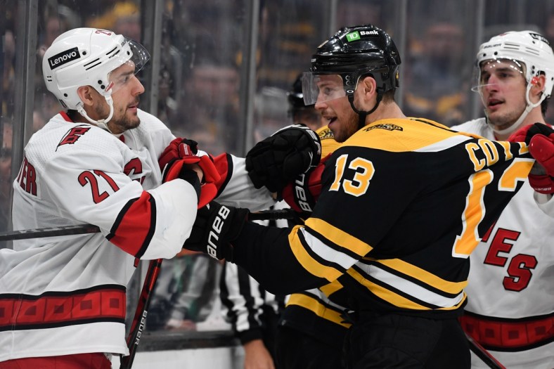 May 12, 2022; Boston, Massachusetts, USA; Boston Bruins center Charlie Coyle (13) shoves Carolina Hurricanes right wing Nino Niederreiter (21) after a whistle during the third period at the TD Garden. Mandatory Credit: Brian Fluharty-USA TODAY Sports