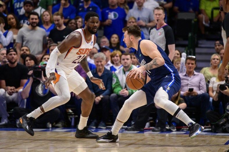 May 12, 2022; Dallas, Texas, USA; Phoenix Suns center Deandre Ayton (22) guards Dallas Mavericks guard Luka Doncic (77) during the first quarter during game six of the second round of the 2022 NBA playoffs at the American Airlines Center. Mandatory Credit: Jerome Miron-USA TODAY Sports