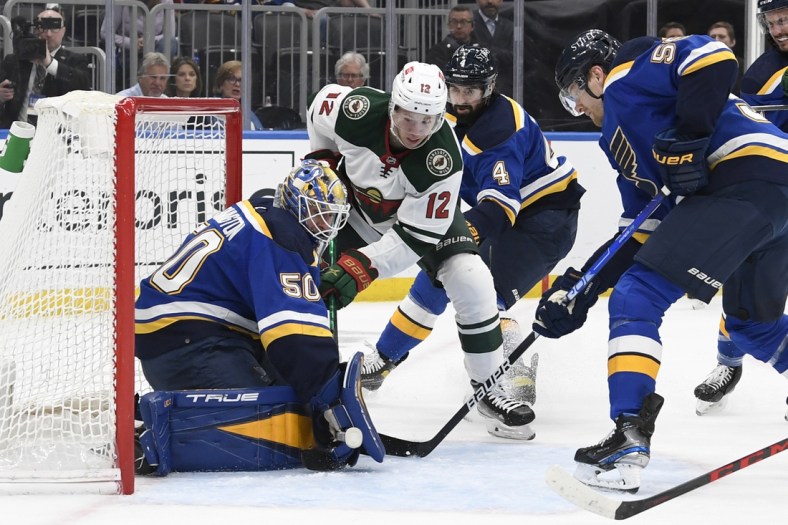 May 12, 2022; St. Louis, Missouri, USA; St. Louis Blues goaltender Jordan Binnington (50) makes a save on Minnesota Wild left wing Matt Boldy (12) during the first period in game six of the first round of the 2022 Stanley Cup Playoffs at Enterprise Center. Mandatory Credit: Jeff Le-USA TODAY Sports