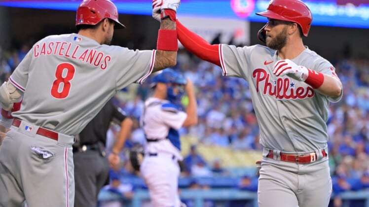 May 12, 2022; Los Angeles, California, USA; Philadelphia Phillies right fielder Bryce Harper (right) is greeted by left fielder Nick Castellanos (8) after hitting a solo home run in the first inning against the Los Angeles Dodgers at Dodger Stadium. Mandatory Credit: Jayne Kamin-Oncea-USA TODAY Sports