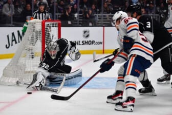 May 12, 2022; Los Angeles, California, USA; Los Angeles Kings goaltender Jonathan Quick (32) defends the goal against Edmonton Oilers right wing Kailer Yamamoto (56) during the third period in game six of the first round of the 2022 Stanley Cup Playoffs at Crypto.com Arena. Mandatory Credit: Gary A. Vasquez-USA TODAY Sports