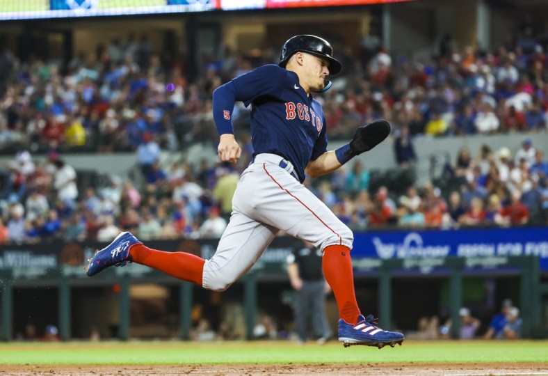 May 13, 2022; Arlington, Texas, USA;  Boston Red Sox center fielder Enrique Hernandez (5) rounds third base and scores during the third inning against the Texas Rangers at Globe Life Field. Mandatory Credit: Kevin Jairaj-USA TODAY Sports
