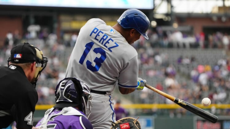 May 13, 2022; Denver, Colorado, USA; Kansas City Royals catcher Salvador Perez (13) doubles in the first inning against the Colorado Rockies at Coors Field. Mandatory Credit: Ron Chenoy-USA TODAY Sports