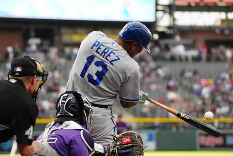 May 13, 2022; Denver, Colorado, USA; Kansas City Royals catcher Salvador Perez (13) doubles in the first inning against the Colorado Rockies at Coors Field. Mandatory Credit: Ron Chenoy-USA TODAY Sports