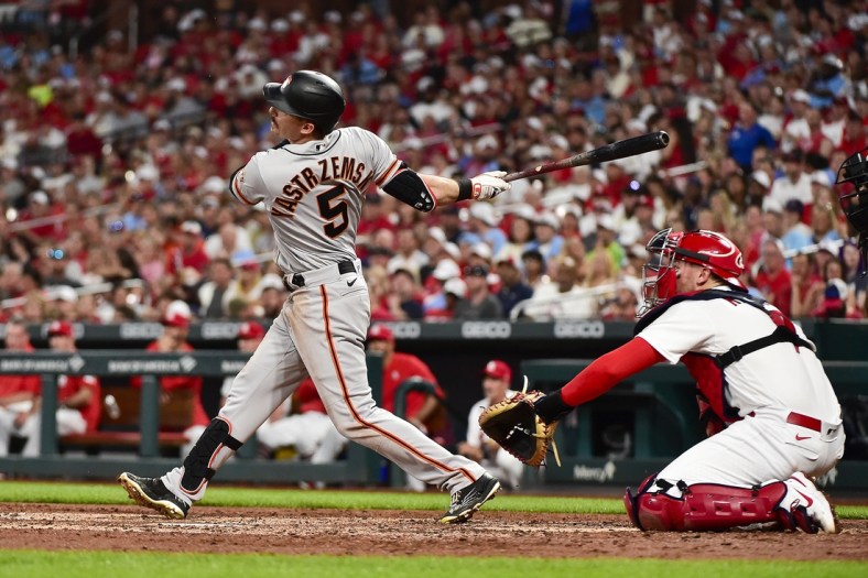 May 13, 2022; St. Louis, Missouri, USA;  San Francisco Giants center fielder Mike Yastrzemski (5) hits a two run double against the St. Louis Cardinals during the third inning at Busch Stadium. Mandatory Credit: Jeff Curry-USA TODAY Sports