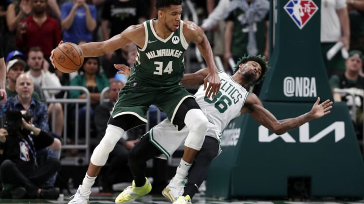May 13, 2022; Milwaukee, Wisconsin, USA;  Boston Celtics guard Marcus Smart (36) falls away from Milwaukee Bucks forward Giannis Antetokounmpo (34) during the fourth quarter during game six of the second round for the 2022 NBA playoffs at Fiserv Forum. Mandatory Credit: Jeff Hanisch-USA TODAY Sports