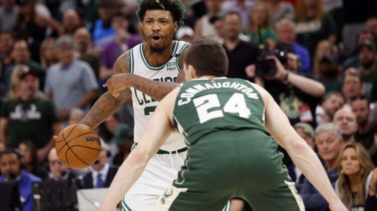 May 13, 2022; Milwaukee, Wisconsin, USA;  Boston Celtics guard Marcus Smart (36) gestures as Milwaukee Bucks guard Pat Connaughton (24) defends during the fourth quarter during game six of the second round for the 2022 NBA playoffs at Fiserv Forum. Mandatory Credit: Jeff Hanisch-USA TODAY Sports