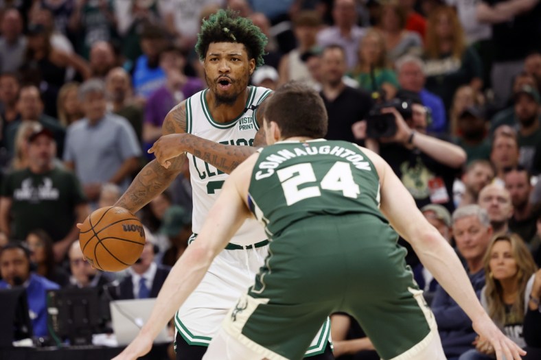 May 13, 2022; Milwaukee, Wisconsin, USA;  Boston Celtics guard Marcus Smart (36) gestures as Milwaukee Bucks guard Pat Connaughton (24) defends during the fourth quarter during game six of the second round for the 2022 NBA playoffs at Fiserv Forum. Mandatory Credit: Jeff Hanisch-USA TODAY Sports