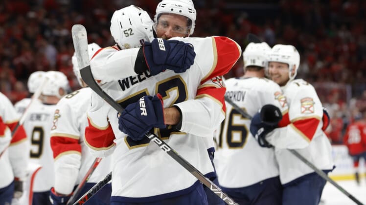 May 13, 2022; Washington, District of Columbia, USA; Florida Panthers defenseman Aaron Ekblad (5) celebrates with Florida Panthers defenseman MacKenzie Weegar (52) after their game against the Washington Capitals in overtime in game six of the first round of the 2022 Stanley Cup Playoffs at Capital One Arena. The Panthers won the series 4-2. Mandatory Credit: Geoff Burke-USA TODAY Sports