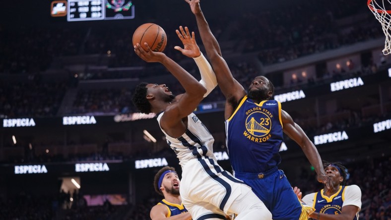 May 13, 2022; San Francisco, California, USA; Memphis Grizzlies forward Jaren Jackson Jr. (13) makes a shot next to Golden State Warriors forward Draymond Green (23) in the second quarter during game six of the second round for the 2022 NBA playoffs at Chase Center. Mandatory Credit: Cary Edmondson-USA TODAY Sports