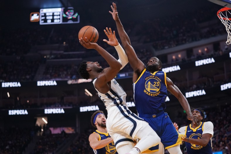 May 13, 2022; San Francisco, California, USA; Memphis Grizzlies forward Jaren Jackson Jr. (13) makes a shot next to Golden State Warriors forward Draymond Green (23) in the second quarter during game six of the second round for the 2022 NBA playoffs at Chase Center. Mandatory Credit: Cary Edmondson-USA TODAY Sports