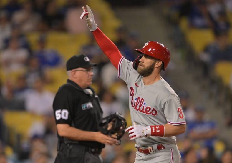 May 13, 2022; Los Angeles, California, USA;  Philadelphia Phillies right fielder Bryce Harper (3) hits a solo home run in the eighth inning against the Los Angeles Dodgers at Dodger Stadium. Mandatory Credit: Jayne Kamin-Oncea-USA TODAY Sports