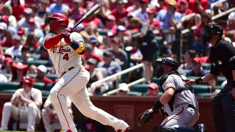 St. Louis Cardinals catcher Yadier Molina (4) hits a double against the San Francisco Giants during the second inning at Busch Stadium. Mandatory Credit: Jeff Curry-USA TODAY Sports