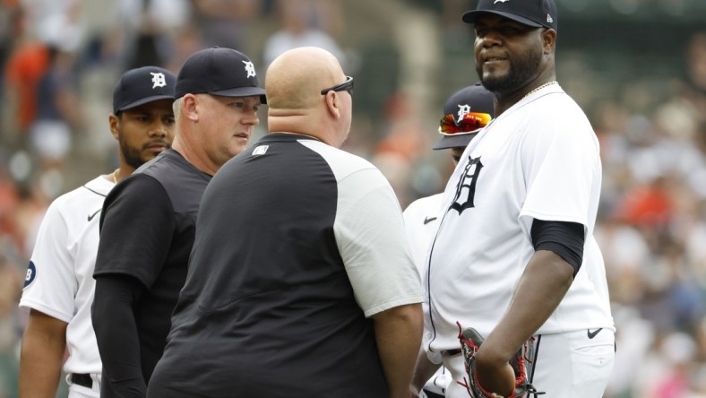 May 14, 2022; Detroit, Michigan, USA;  Detroit Tigers manager A.J. Hinch (14) and head trainer Doug Teter  check on starting pitcher Michael Pineda (38) during the second inning against the Baltimore Orioles at Comerica Park. Mandatory Credit: Rick Osentoski-USA TODAY Sports