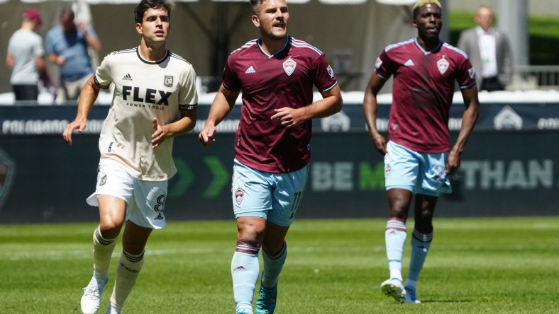 May 14, 2022; Commerce City, Colorado, USA; Los Angeles FC midfielder Francisco Ginella (8) and Colorado Rapids forward Diego Rubio (11) during the first half at Dick's Sporting Goods Park. Mandatory Credit: Ron Chenoy-USA TODAY Sports