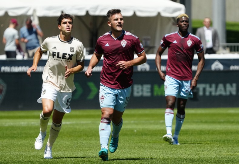 May 14, 2022; Commerce City, Colorado, USA; Los Angeles FC midfielder Francisco Ginella (8) and Colorado Rapids forward Diego Rubio (11) during the first half at Dick's Sporting Goods Park. Mandatory Credit: Ron Chenoy-USA TODAY Sports