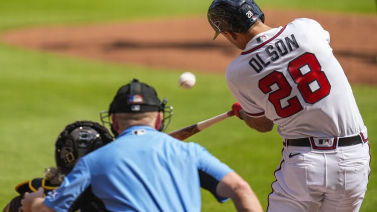 May 14, 2022; Cumberland, Georgia, USA; Atlanta Braves first baseman Matt Olson (28) hits a home run against the San Diego Padres during the first inning at Truist Park. Mandatory Credit: Dale Zanine-USA TODAY Sports