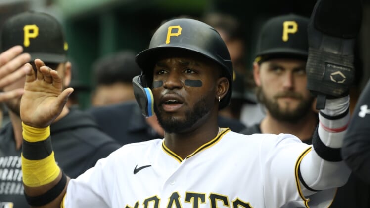 May 14, 2022; Pittsburgh, Pennsylvania, USA; Pittsburgh Pirates shortstop Rodolfo Castro (14) celebrates in the dugout after scoring a run against the Cincinnati Reds during the second inning at PNC Park. Mandatory Credit: Charles LeClaire-USA TODAY Sports