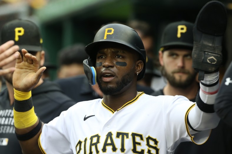 May 14, 2022; Pittsburgh, Pennsylvania, USA; Pittsburgh Pirates shortstop Rodolfo Castro (14) celebrates in the dugout after scoring a run against the Cincinnati Reds during the second inning at PNC Park. Mandatory Credit: Charles LeClaire-USA TODAY Sports