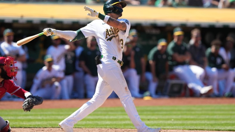 May 14, 2022; Oakland, California, USA; Oakland Athletics left fielder Luis Barrera (13) hits a home run against the Los Angeles Angels during the ninth inning at RingCentral Coliseum. Mandatory Credit: Darren Yamashita-USA TODAY Sports