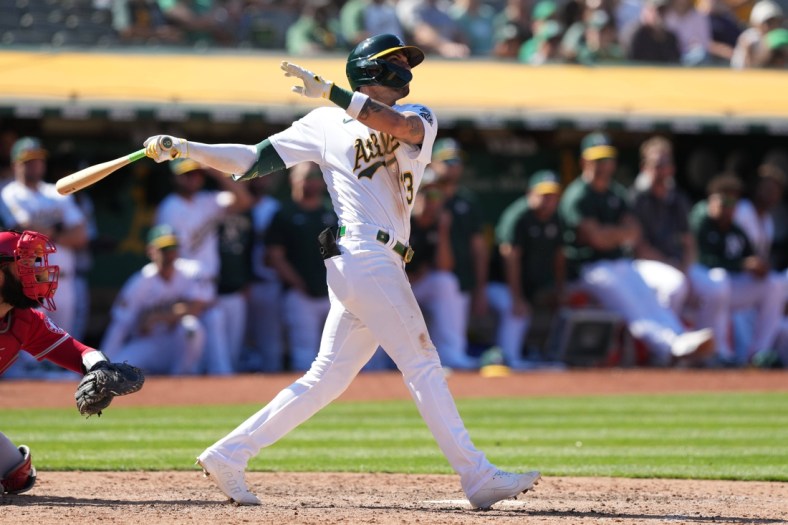 May 14, 2022; Oakland, California, USA; Oakland Athletics left fielder Luis Barrera (13) hits a home run against the Los Angeles Angels during the ninth inning at RingCentral Coliseum. Mandatory Credit: Darren Yamashita-USA TODAY Sports