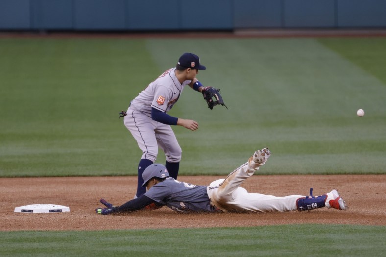 May 14, 2022; Washington, District of Columbia, USA; Washington Nationals left fielder Juan Soto (22) slides into second base with a double ahead of a tag by Houston Astros second baseman Aledmys Diaz (16) during the first inning at Nationals Park. Mandatory Credit: Geoff Burke-USA TODAY Sports