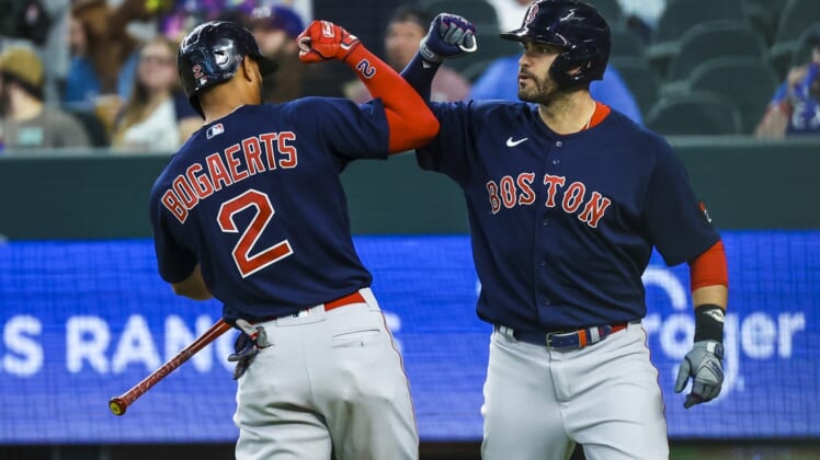 May 14, 2022; Arlington, Texas, USA; Boston Red Sox designated hitter J.D. Martinez (28) celebrates with Boston Red Sox shortstop Xander Bogaerts (2) after hitting a home run during the first inning against the Texas Rangers at Globe Life Field. Mandatory Credit: Kevin Jairaj-USA TODAY Sports