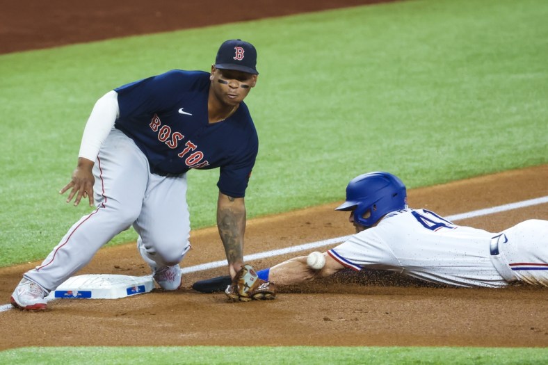 May 14, 2022; Arlington, Texas, USA; Texas Rangers center fielder Eli White (41) steals second base ahead of the tag by Boston Red Sox third baseman Rafael Devers (11) during the first inning at Globe Life Field. Mandatory Credit: Kevin Jairaj-USA TODAY Sports