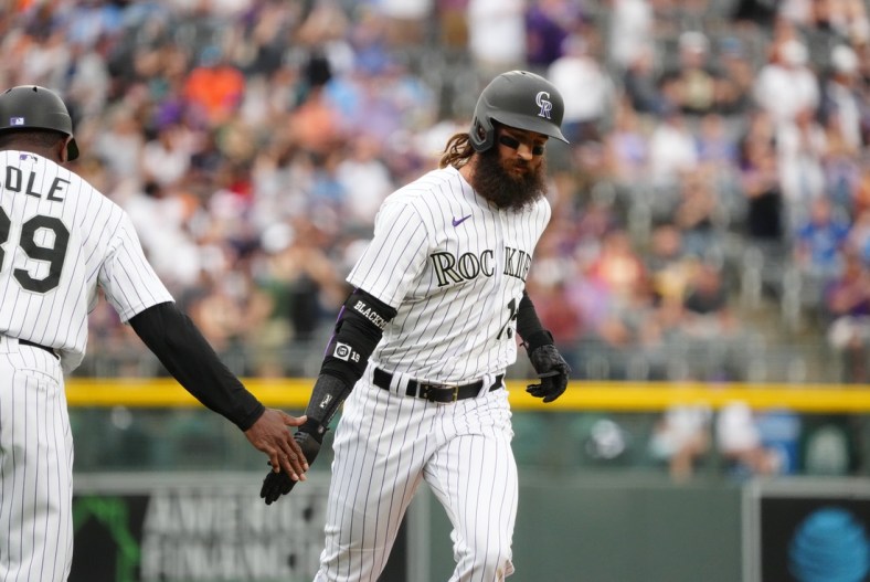 May 14, 2022; Denver, Colorado, USA; Colorado Rockies right fielder Charlie Blackmon (19) runs out a two-run home run in the first inning against the Kansas City Royals at Coors Field. Mandatory Credit: Ron Chenoy-USA TODAY Sports