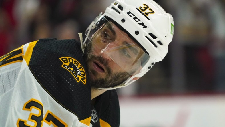 May 14, 2022; Raleigh, North Carolina, USA; Boston Bruins center Patrice Bergeron (37) looks on during the third period against the Carolina Hurricanes in game seven of the first round of the 2022 Stanley Cup Playoffs at PNC Arena. Mandatory Credit: James Guillory-USA TODAY Sports