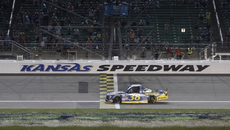 May 14, 2022; Kansas City, Kansas, USA; NASCAR Truck Series driver Zane Smith (38) crosses the finish line to win the Truck Series Heart of America 200 at Kansas Speedway. Mandatory Credit: Amy Kontras-USA TODAY Sports