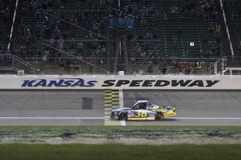 May 14, 2022; Kansas City, Kansas, USA; NASCAR Truck Series driver Zane Smith (38) crosses the finish line to win the Truck Series Heart of America 200 at Kansas Speedway. Mandatory Credit: Amy Kontras-USA TODAY Sports