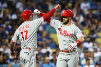 May 14, 2022; Los Angeles, California, USA; Philadelphia Phillies right fielder Bryce Harper (3) and first baseman Rhys Hoskins (17) celebrate after a home run against the Los Angeles Dodgers during the third inning at Dodger Stadium. Mandatory Credit: Jonathan Hui-USA TODAY Sports