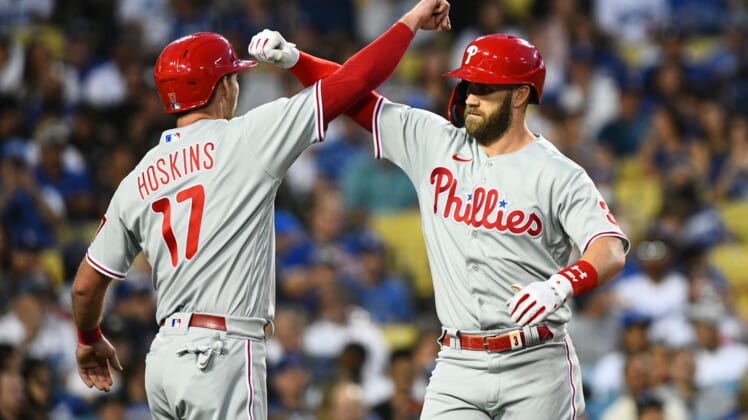 May 14, 2022; Los Angeles, California, USA; Philadelphia Phillies right fielder Bryce Harper (3) and first baseman Rhys Hoskins (17) celebrate after a home run against the Los Angeles Dodgers during the third inning at Dodger Stadium. Mandatory Credit: Jonathan Hui-USA TODAY Sports