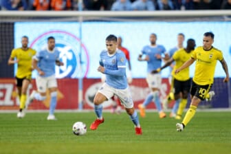 May 14, 2022; New York, New York, USA; New York City FC midfielder Nicolas Acevedo (26) brings the ball up the pitch against Columbus Crew midfielder Lucas Zelarrayan (10) during the first half at Yankee Stadium. Mandatory Credit: Brad Penner-USA TODAY Sports