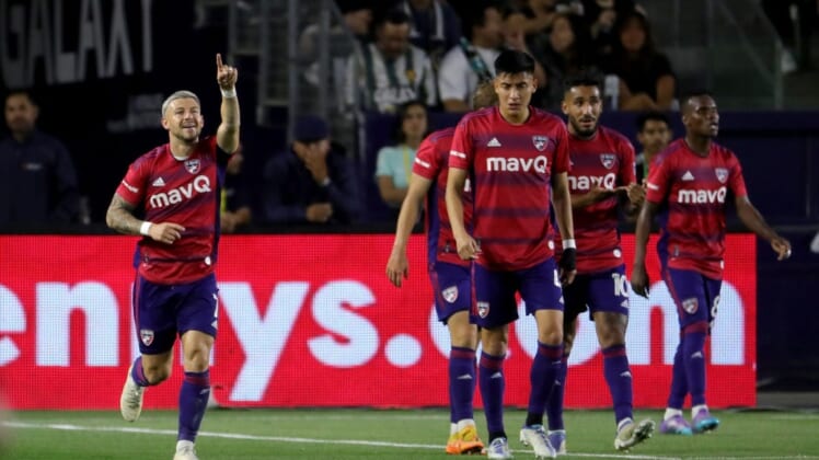 May 14, 2022; Carson, California, USA;  FC Dallas forward Paul Arriola (left) reacts after scoring a goal against the Los Angeles Galaxy during the first half at Dignity Health Sports Park. Mandatory Credit: Kiyoshi Mio-USA TODAY Sports
