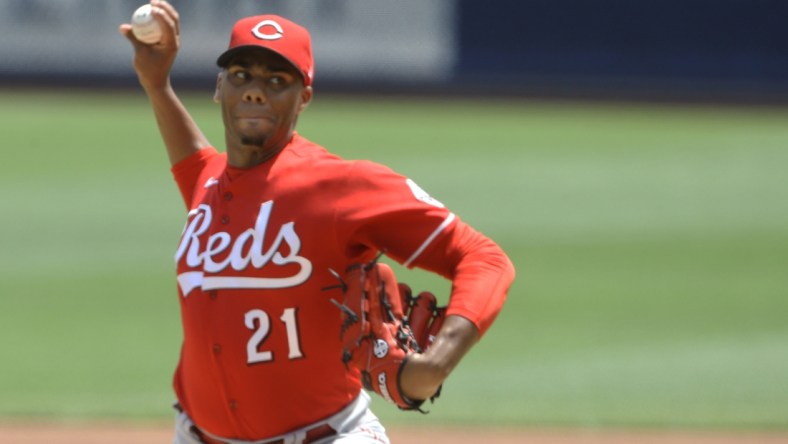 May 15, 2022; Pittsburgh, Pennsylvania, USA;  Cincinnati Reds starting pitcher Hunter Greene (21) delivers a pitch against the Pittsburgh Pirates during the first inning at PNC Park. Mandatory Credit: Charles LeClaire-USA TODAY Sports