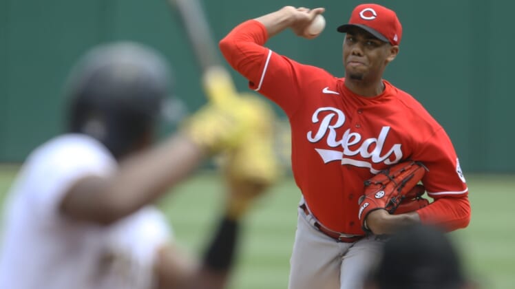 May 15, 2022; Pittsburgh, Pennsylvania, USA;  Cincinnati Reds starting pitcher Hunter Greene (21) pitches to Pittsburgh Pirates third baseman Ke'Bryan Hayes (13) during the first inning at PNC Park. Mandatory Credit: Charles LeClaire-USA TODAY Sports
