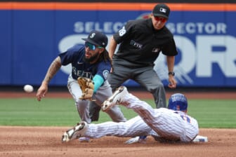 May 15, 2022; New York City, New York, USA; New York Mets left fielder Mark Canha (19) is caught stealing on a tag by Seattle Mariners shortstop J.P. Crawford (3) during the second inning at Citi Field. Mandatory Credit: Vincent Carchietta-USA TODAY Sports