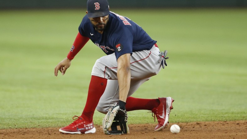 May 15, 2022; Arlington, Texas, USA; Boston Red Sox shortstop Xander Bogaerts (2) fields a ground ball in the fifth inning against the Texas Rangers at Globe Life Field. Mandatory Credit: Tim Heitman-USA TODAY Sports