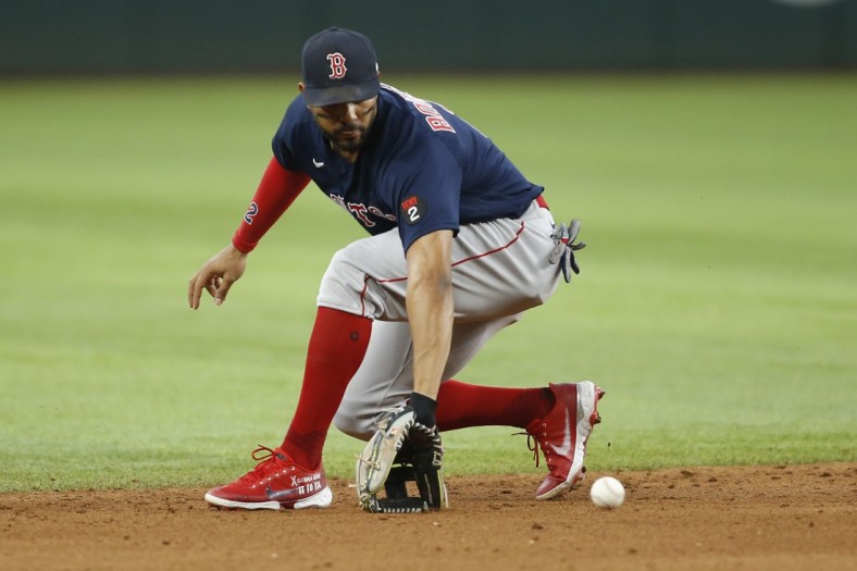 May 15, 2022; Arlington, Texas, USA; Boston Red Sox shortstop Xander Bogaerts (2) fields a ground ball in the fifth inning against the Texas Rangers at Globe Life Field. Mandatory Credit: Tim Heitman-USA TODAY Sports