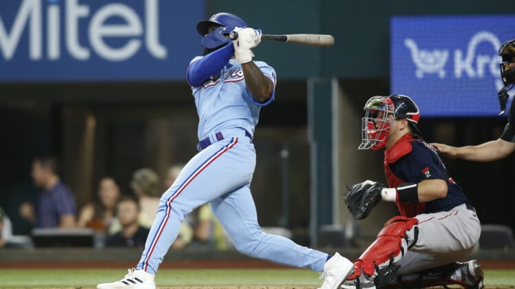 May 15, 2022; Arlington, Texas, USA; Texas Rangers center fielder Adolis Garcia (53) hits a home run against the Boston Red Sox in the sixth inning at Globe Life Field. Mandatory Credit: Tim Heitman-USA TODAY Sports