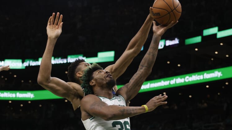 May 15, 2022; Boston, Massachusetts, USA; Milwaukee Bucks forward Giannis Antetokounmpo (34) comes from behind to block a shot by Boston Celtics guard Marcus Smart (36) during the second quarter of game seven of the second round of the 2022 NBA playoffs at TD Garden. Mandatory Credit: Winslow Townson-USA TODAY Sports